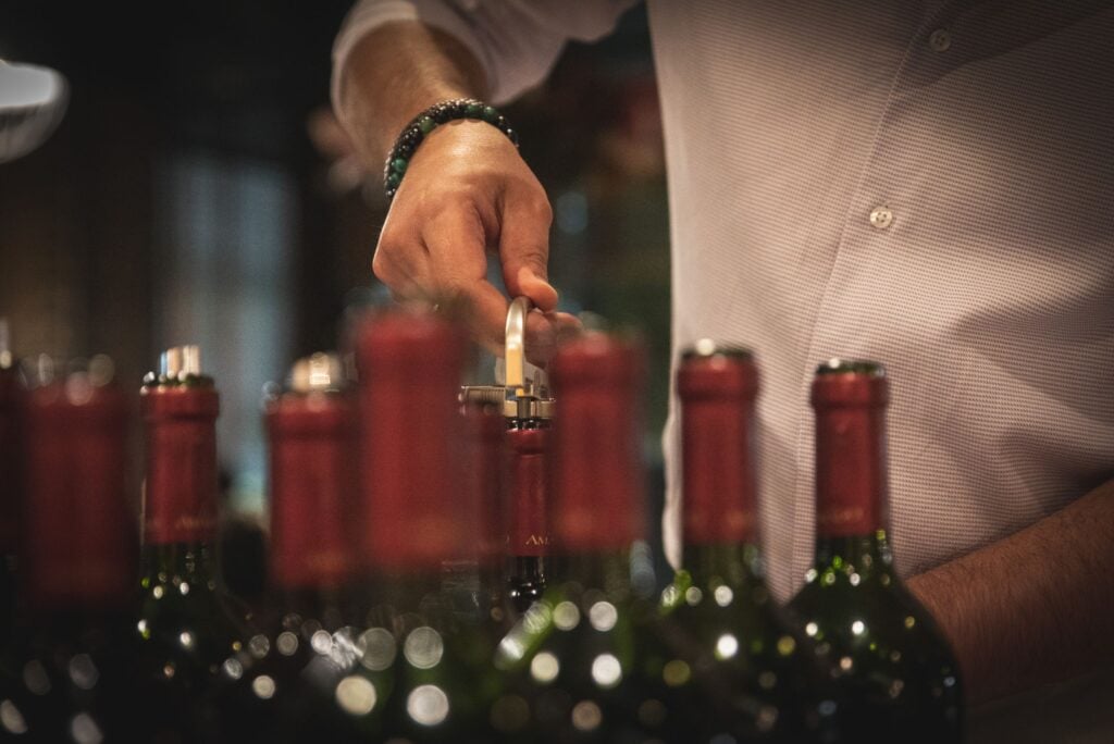 Collectors analysing critic scores for wine investment